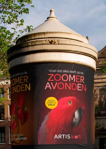 Promotion of the ARTIS Zoo-summer evenings on an advertising kiosk in Amsterdam.