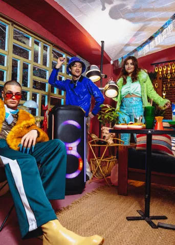 people dancing on music comming from a JBL box